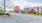 a street with cars and trees