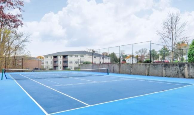 a tennis court with a fence